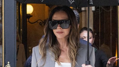 Victoria Beckham makes a speedy outfit change into a chic grey suit as she steps out for her show during Paris Fashion Week