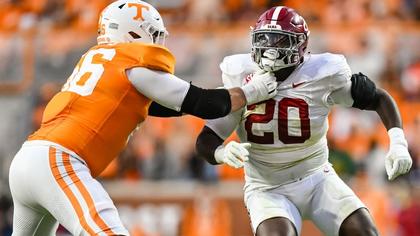 Alabama's Latham hospitalized with neck injury
