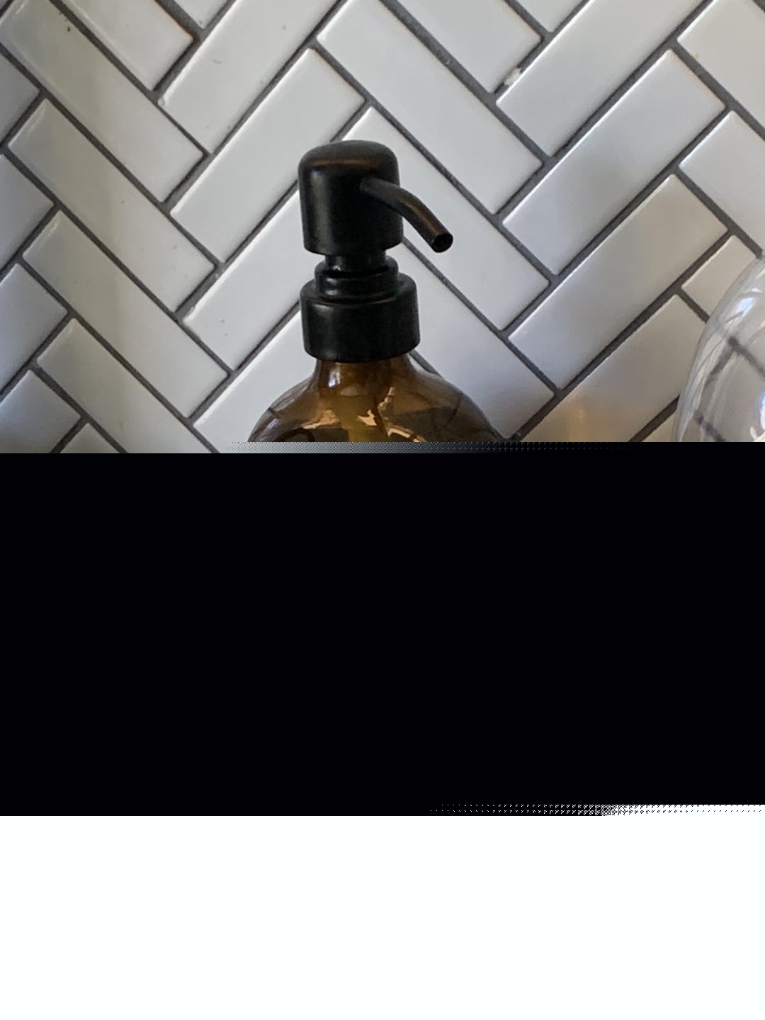 Mildly Interesting - This soap bottle warping the wall pattern into squiggles
