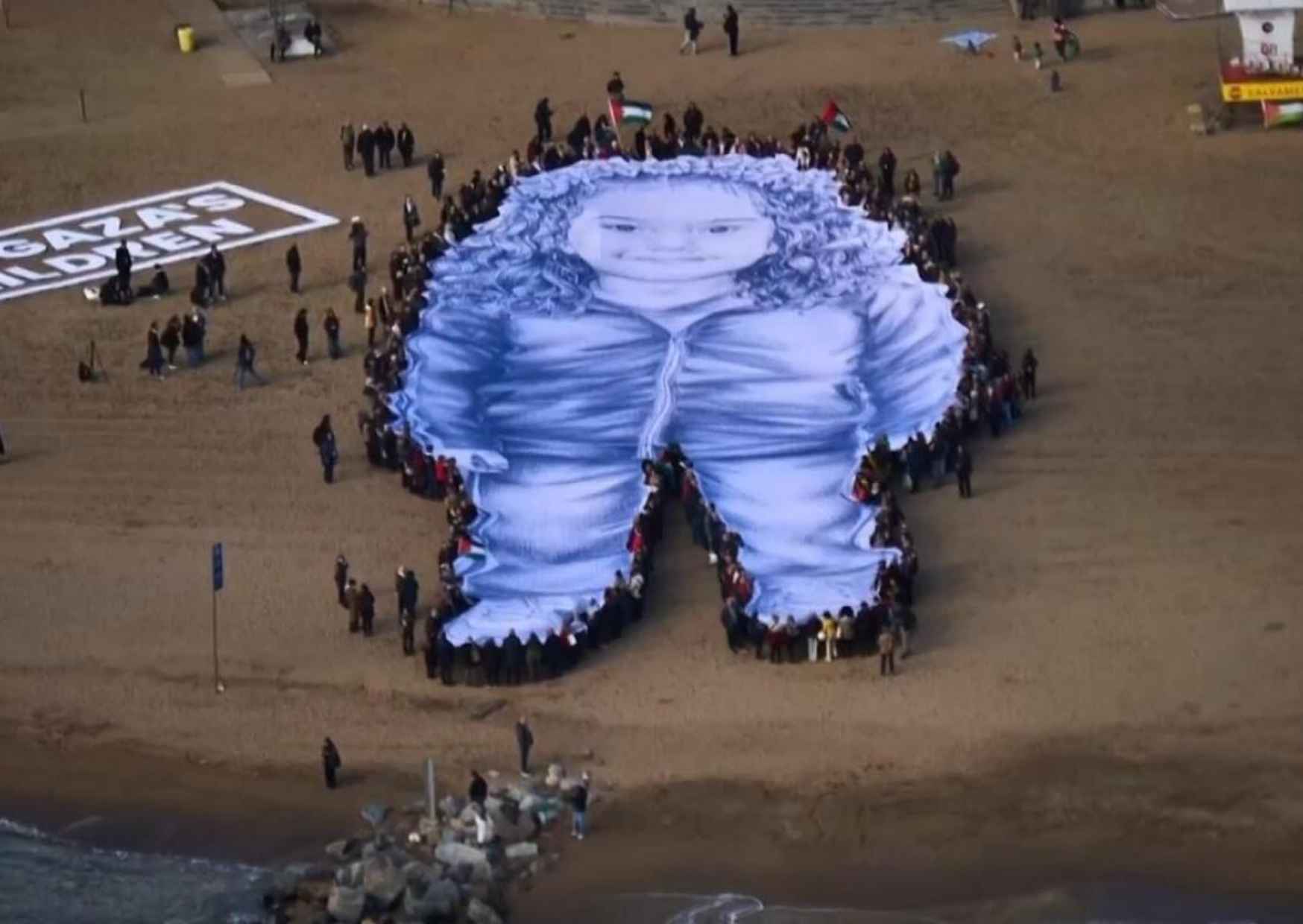 Barcelona Protesters Unfurl Giant Portrait of Hind Rajab — Why Her Story Still Haunts the World