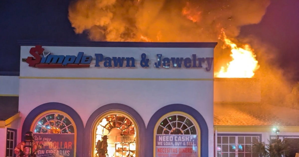 Photos: Massive fire at Kissimmee pawn shop; 1 firefighter hurt, official says