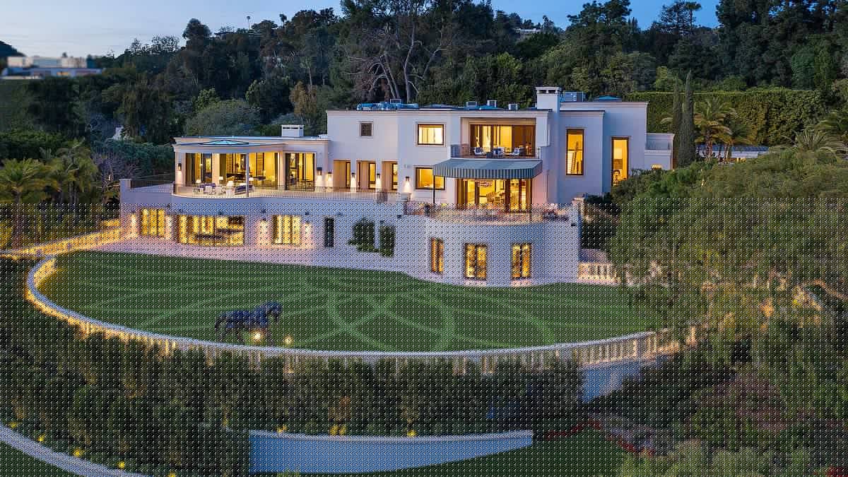 Billionaire mogul accepts defeat and sells mansion for $87m LESS than asking price as millionaires flee California in droves