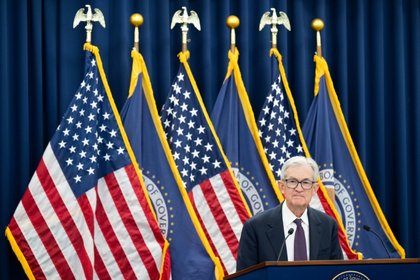 US Fed holds interest rates steady, defying Trump pressure