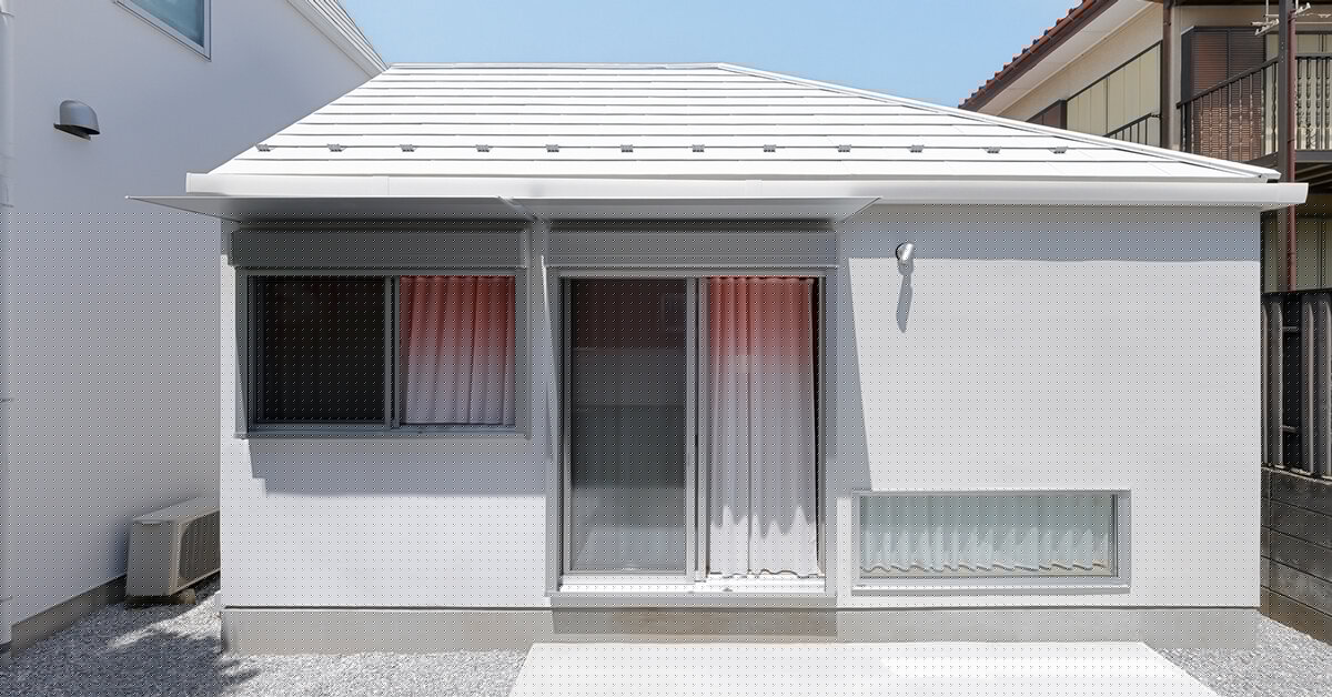shifted roofs and reflected light connect old and new homes in suburban tokyo