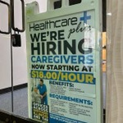 US applications for jobless benefits tick down to 209,000 last week