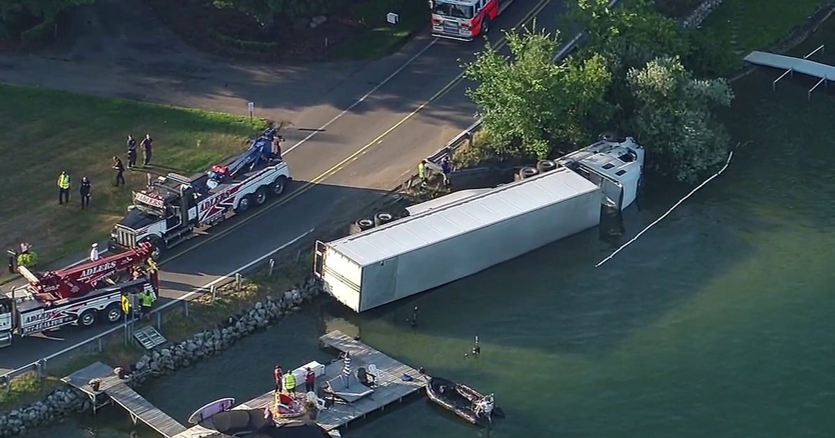 Semi-truck tips into Pine Lake in West Bloomfield, first responders on scene