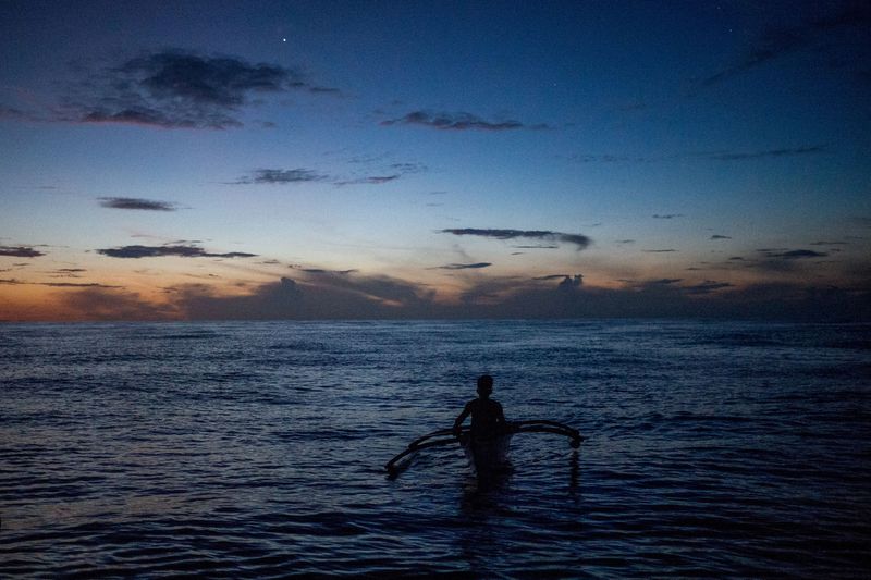 China holds National Day ceremony in waters off atoll claimed by Philippines