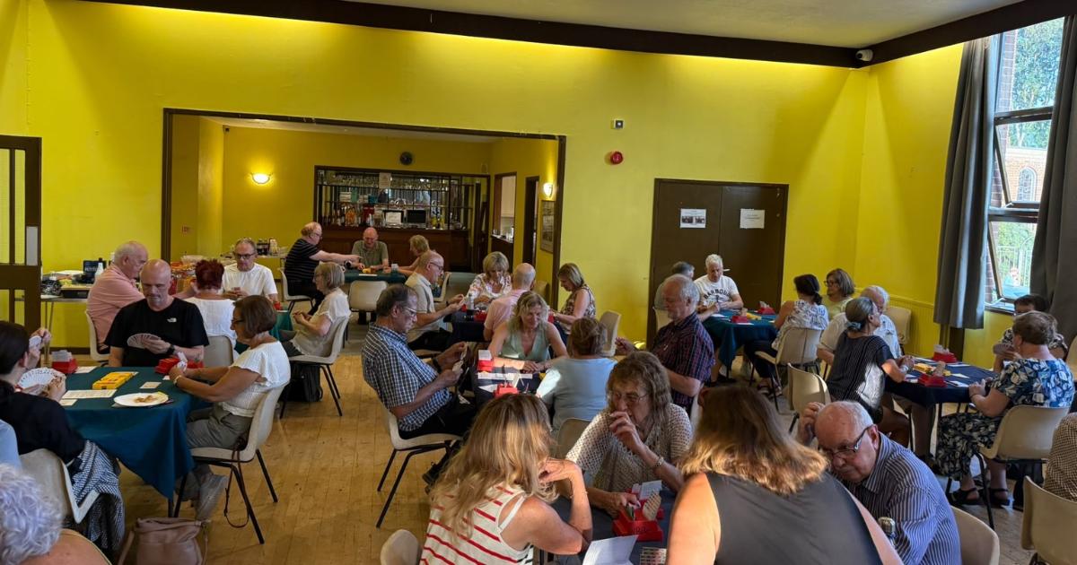 Bridge players deal £655 boost to Bushey food bank at summer party