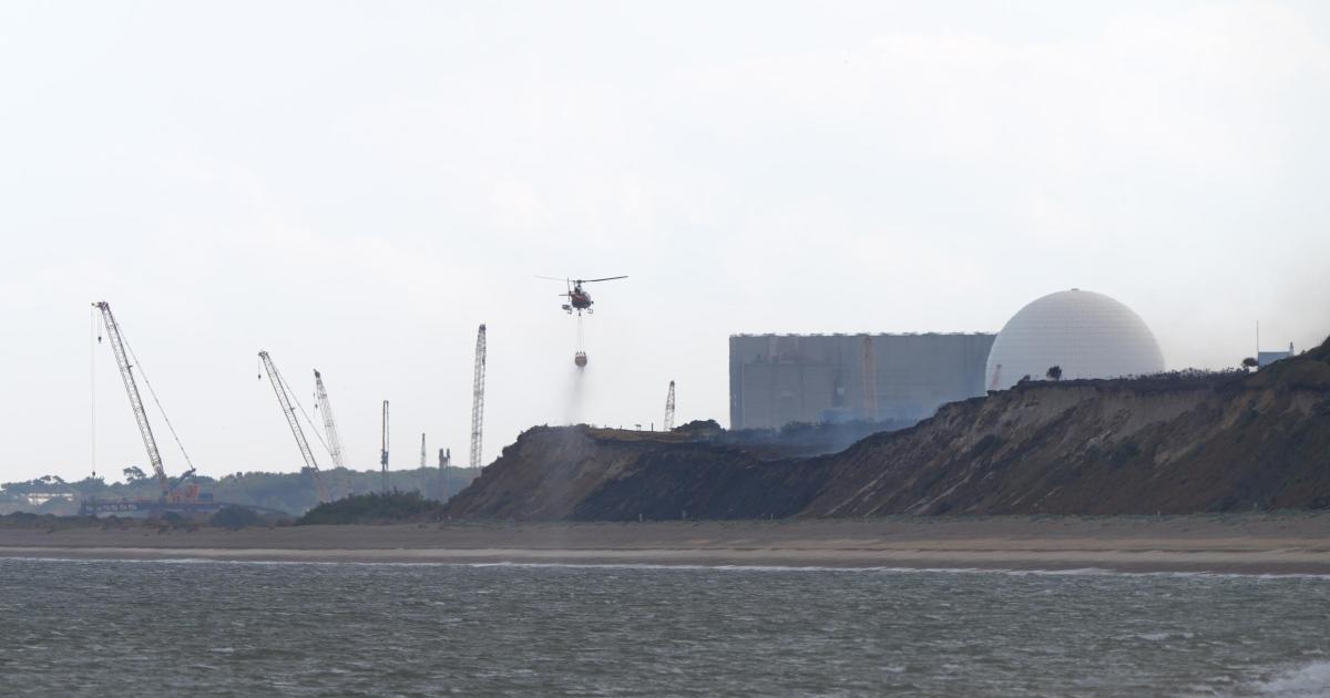 Helicopter called in to drop water over heath wildfire