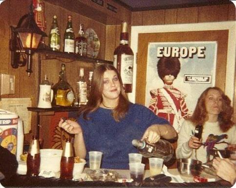 History / Nostalgia - Serving drinks at her homemade bar, 1970s
