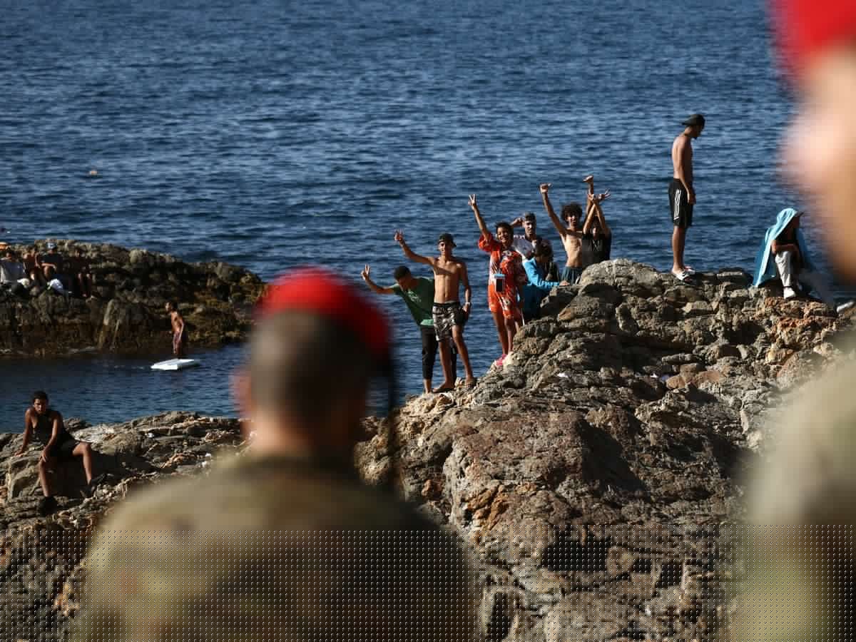 Did Morocco allow thousands of migrants to cross into a Spanish enclave, and if so, why?