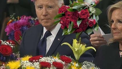 Awkwardness ensues when mourners at Jimmy Carter funeral place flowers on Biden instead