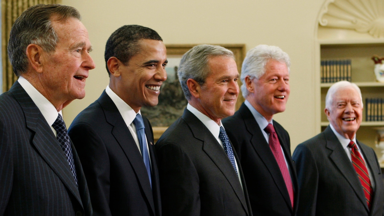 Trump goes unmentioned but not ignored as Clinton, Bush and Obama step up as essayists on presidents