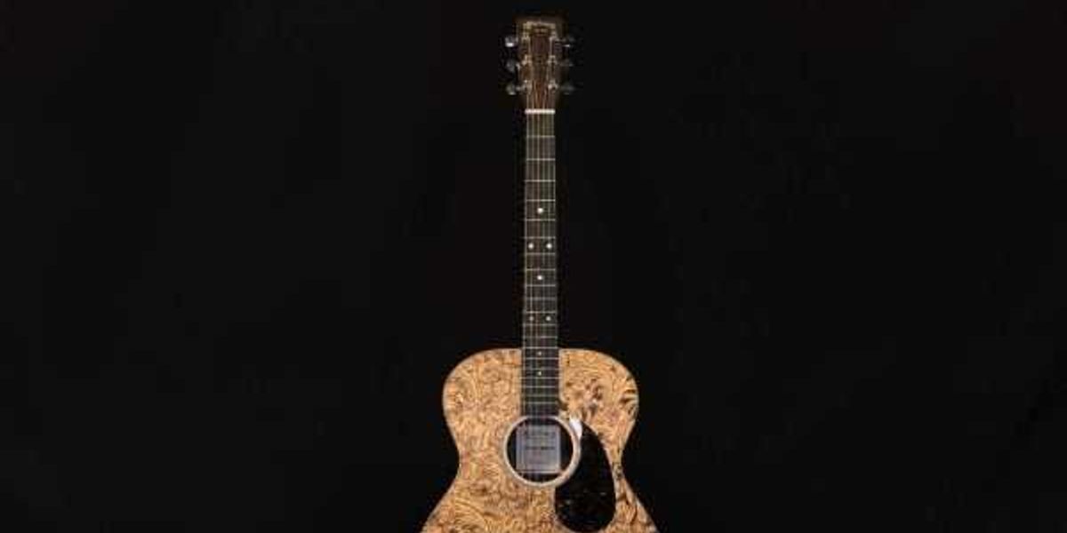 Auction for Austin orgs includes guitar signed by George Strait and more