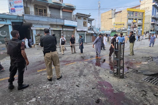 A suicide bomber strikes an antimilitant rally in northwestern Pakistan, killing at least 14