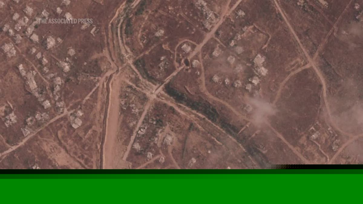 Israel is building a miles-long earthen barrier inside Gaza, entrenching its division