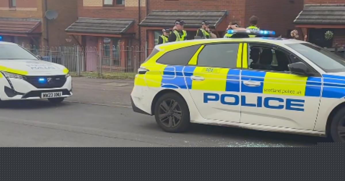 Masked mob hurl bricks at police in Glasgow street, injuring three officers