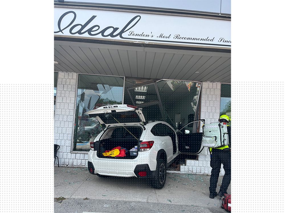 Store manager shaken after car crashes through London business