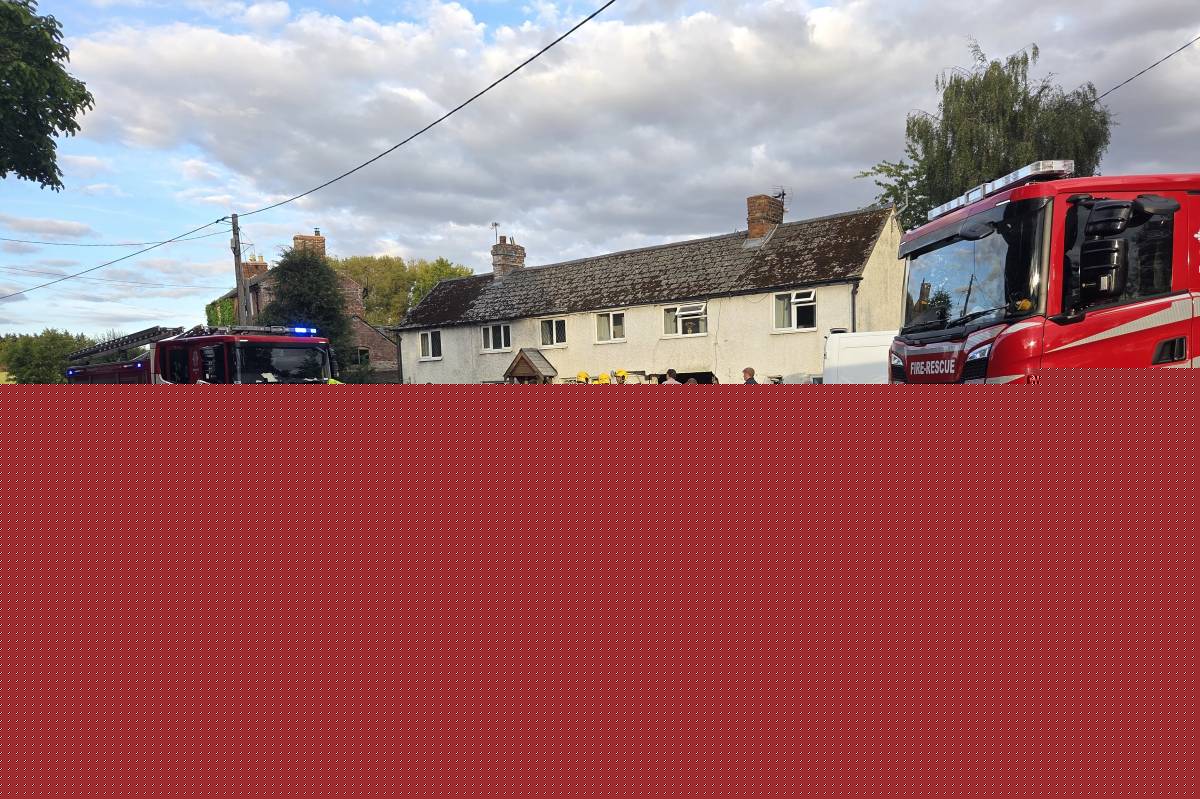 Two injured after car flips onto roof after colliding with house in Nox