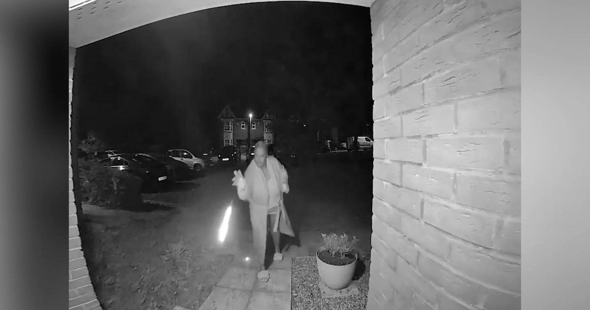 Moment attempted arsonist flicks matches at neighbour's doormat in revenge row
