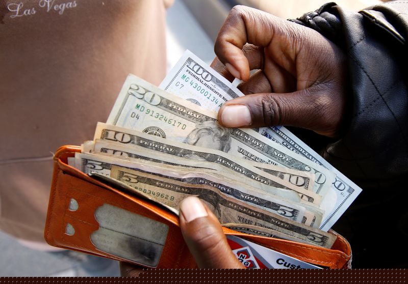 Dollar falls ahead of data releases, risk of US government shutdown looms
