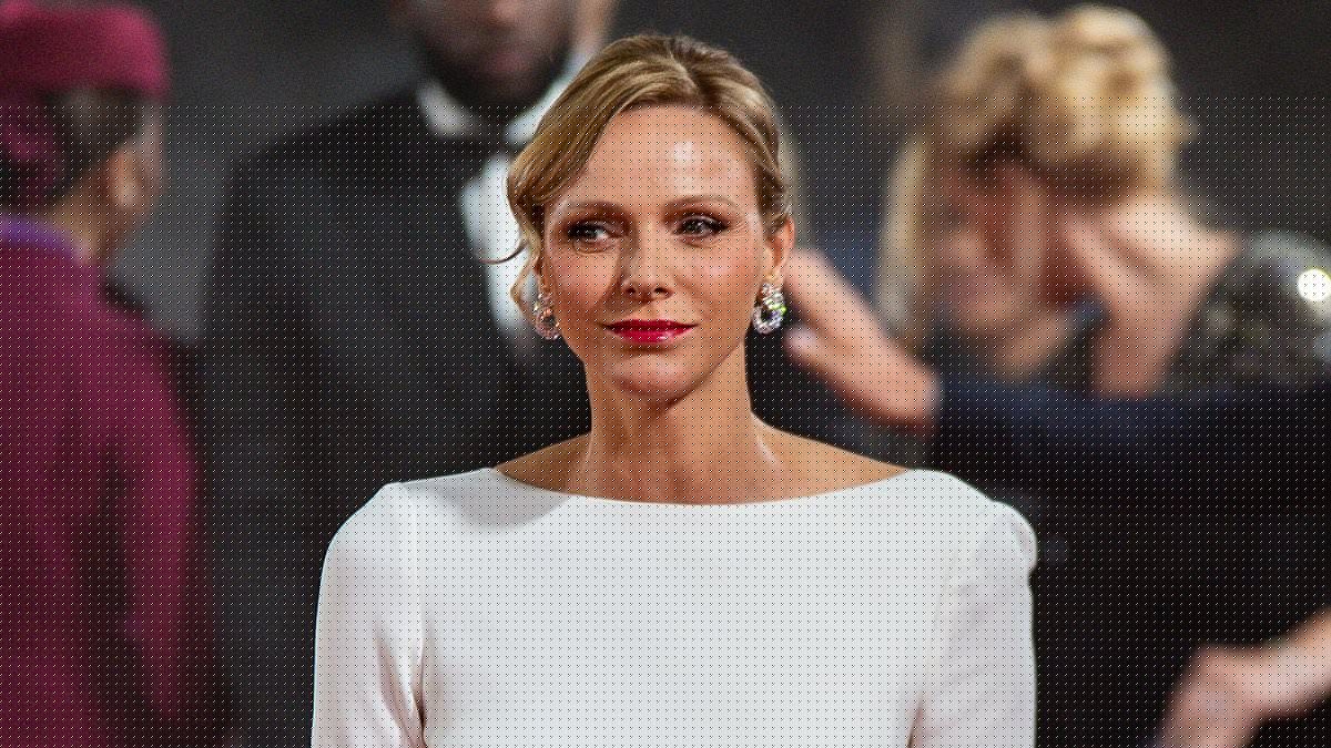 Princess Charlene of Monaco, 47, stuns in a showstopping white backless gown during solo appearance at the Ballon D'Or - and makes rare reference to her time as an Olympic athlete