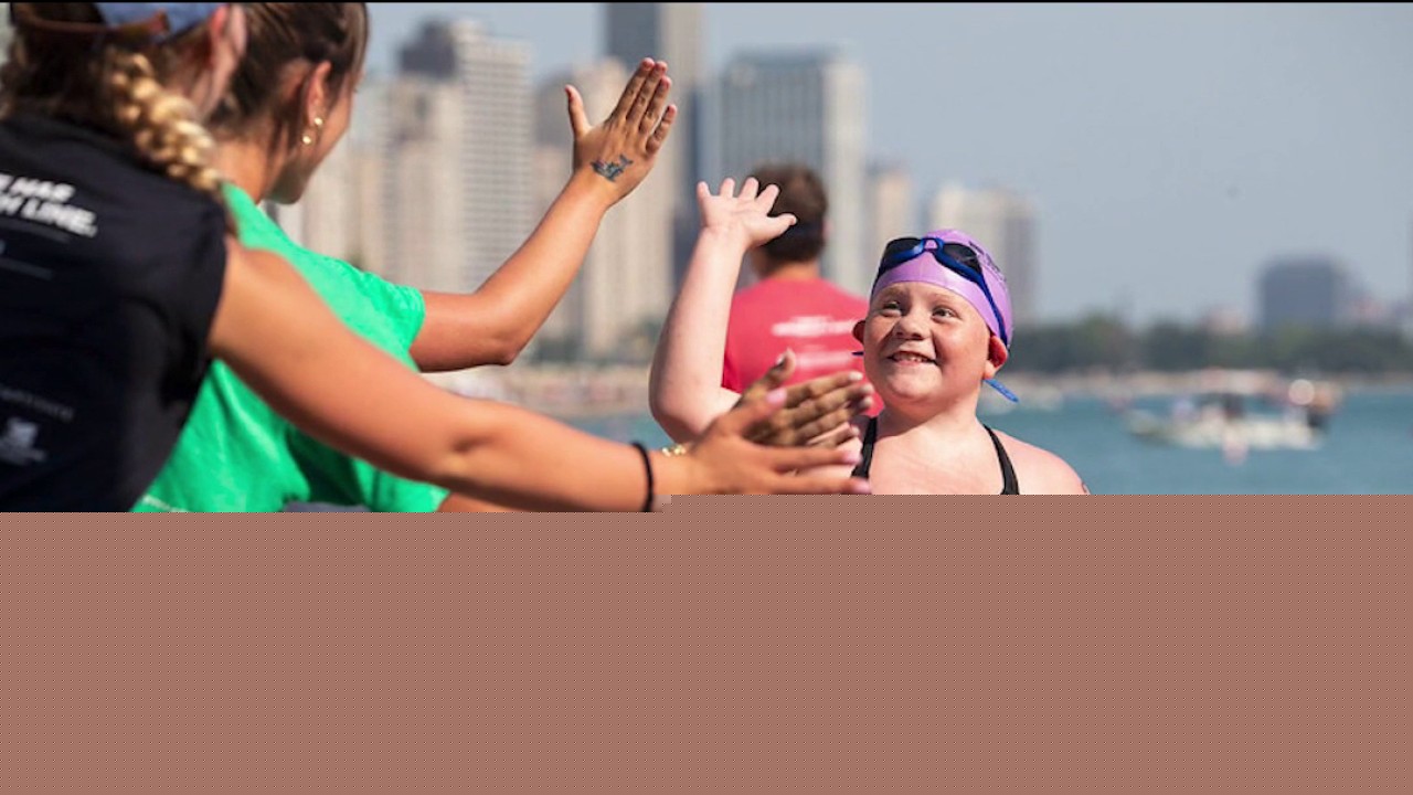 Hundreds of swimmers dive into Lake Michigan for cancer research