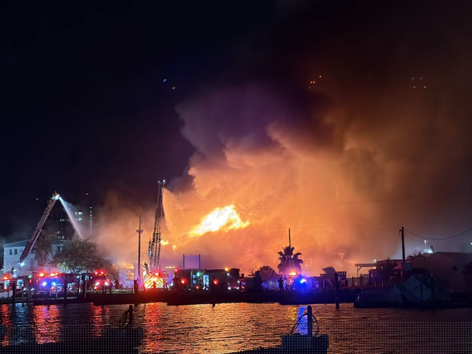 Three people and a dog rescued from fire at Galveston seafood warehouse, city says