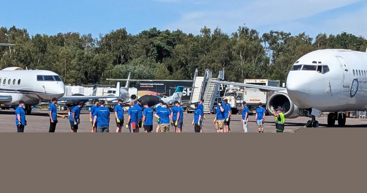 Dorset teams prepare to pull a Boeing 737 at Bournemouth Airport for Dorset Mind
