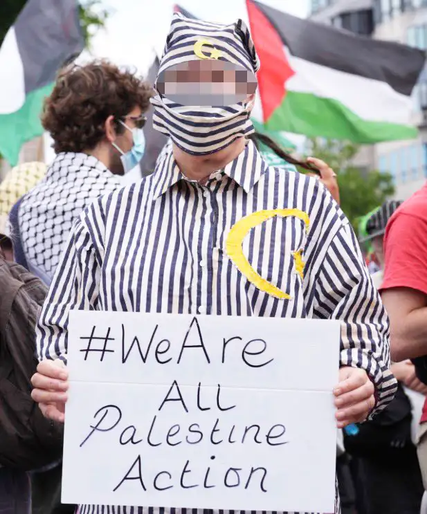 Police arrest Palestine protester dressed in mock Holocaust victim pyjamas