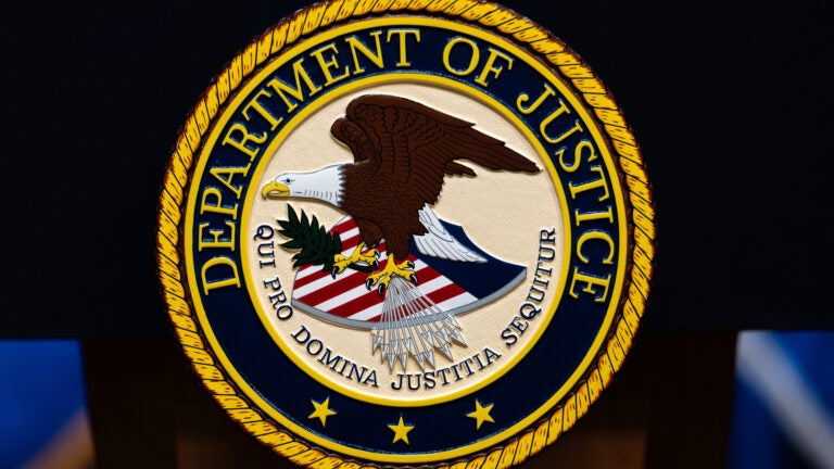 Federal prosecutor who was fired over years-old blog posts critical of Trump sues Justice Department