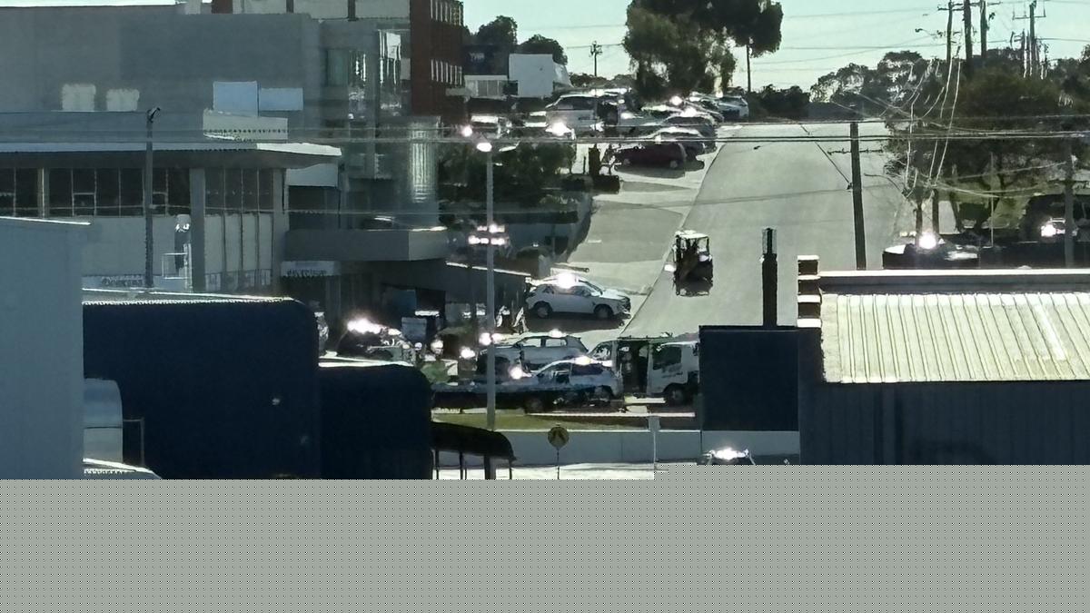 Police officers close Scarborough Beach Road between Hutton Street and Drake Street amid serious crash