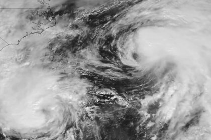 Two hurricanes perform ‘waltz’ while approaching US coastline in rare weather event