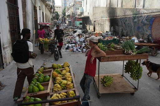 Cubans sleep on seaside boardwalk to seek relief from crippling blackouts and summer heat