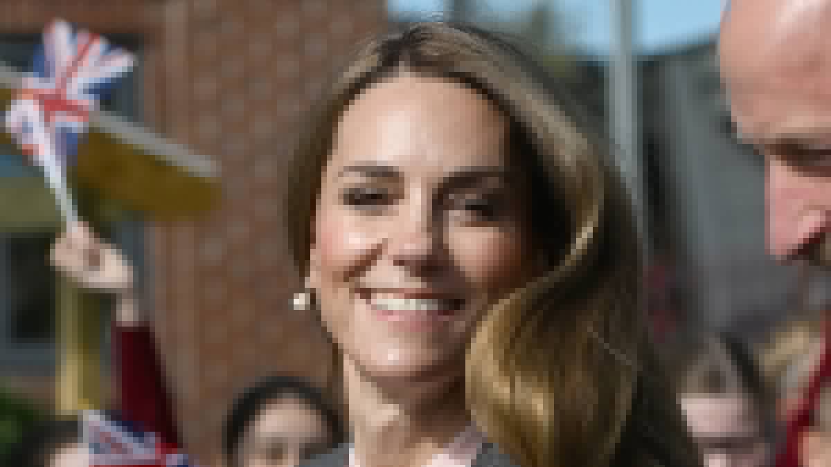 Kate is effortlessly elegant with lightened tresses as she joins William in Southport