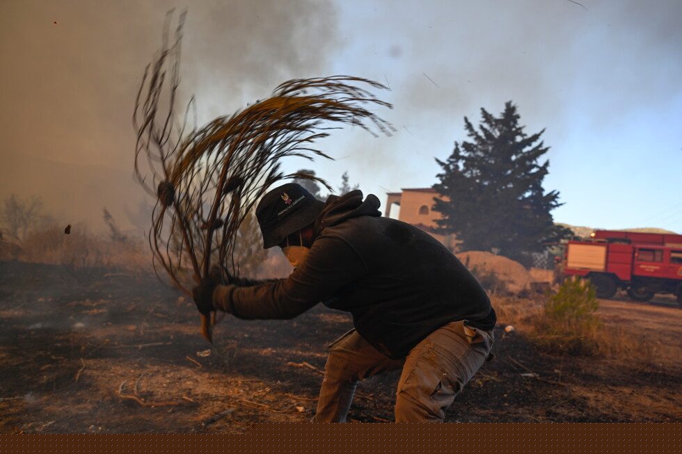 Water-dropping aircraft take off to tackle major Greek wildfire, after 2 killed in crash