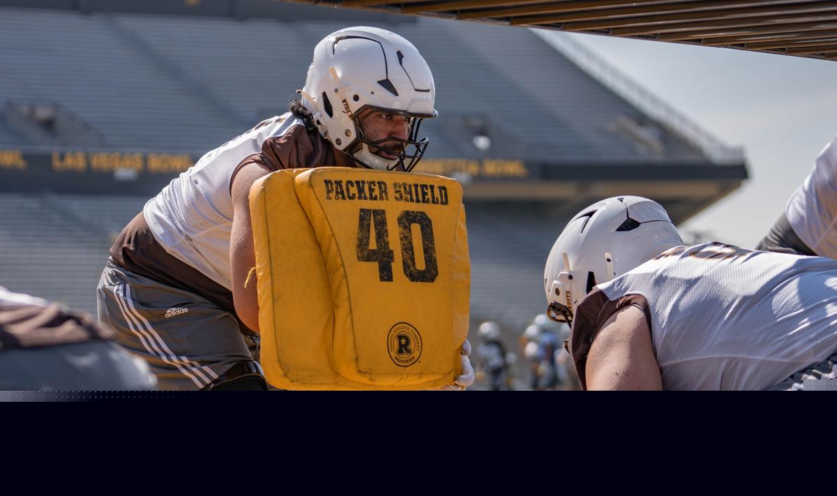 Wyoming's Smiley Samoan Slides Into Potential Starting Role