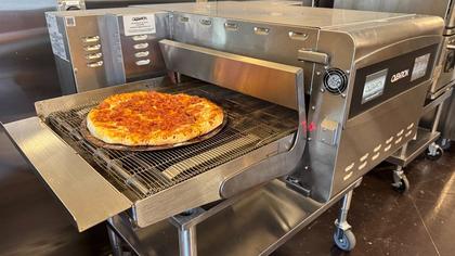 Modern equipment eases today's work in the pizzeria