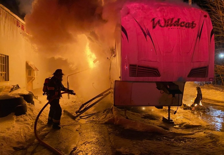 Fire destroys fifth-wheel camper in Farmington; firefighters save adjacent vehicle dealership building
