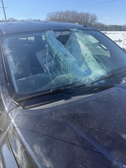 Ice impales car windshield, passenger suffers cuts