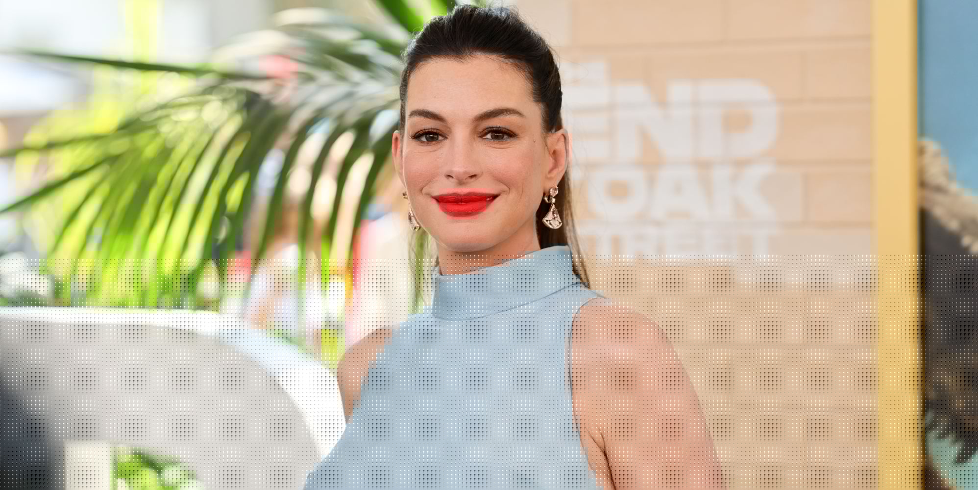 Anne Hathaway mocks critics as she’s ‘transvestigated’ over baby bump