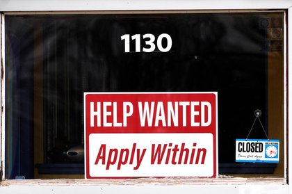 US applications for jobless benefits, a proxy for layoffs, tick down to 209,000 last week