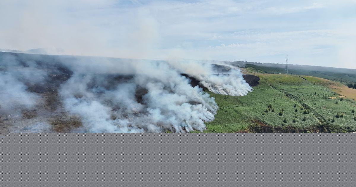 Major wildfire expected to burn for days as crews battle changing winds