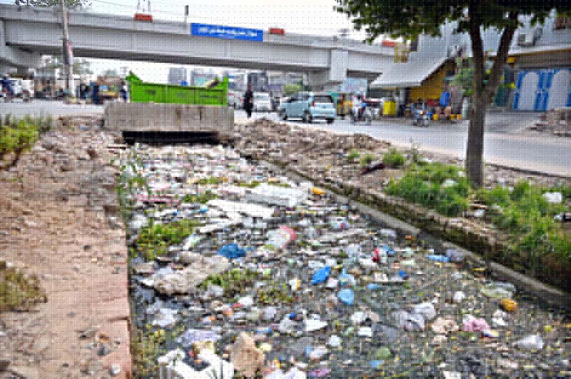 A canal near 47 Pull is choked with garbage, posing health and environmental hazards and highlighting the need for immediate cleaning