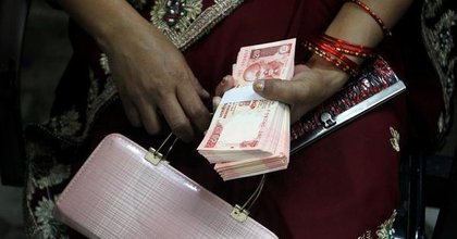 Indian rupee sinks to record low of nearly 92 per US dollar