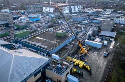 Crane lifts heat pumps onto hospital roof as part of £16.2m project