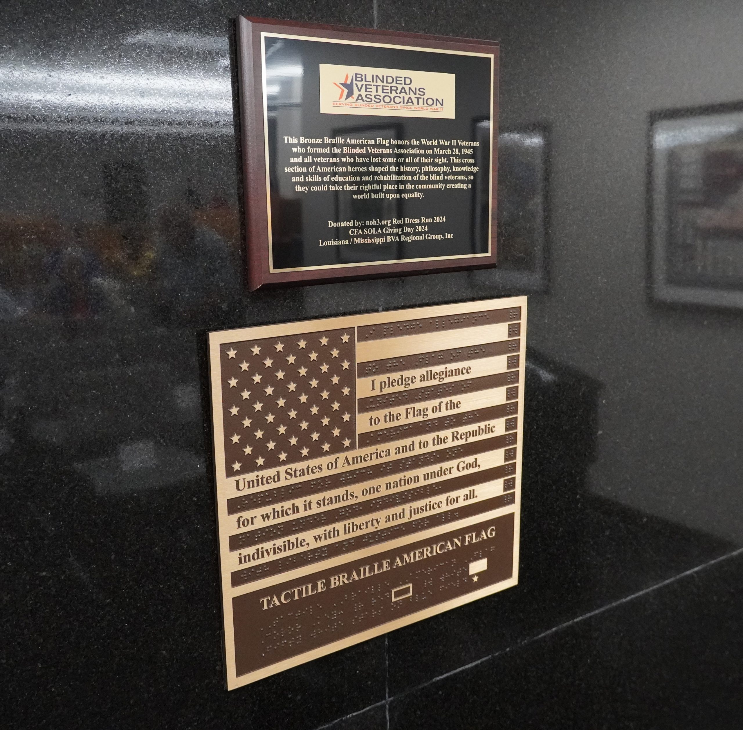 Blind veterans group donates braille American flag to library