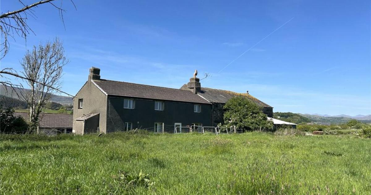 Farmhouse with 14 acres of land and classic stone barns on the market