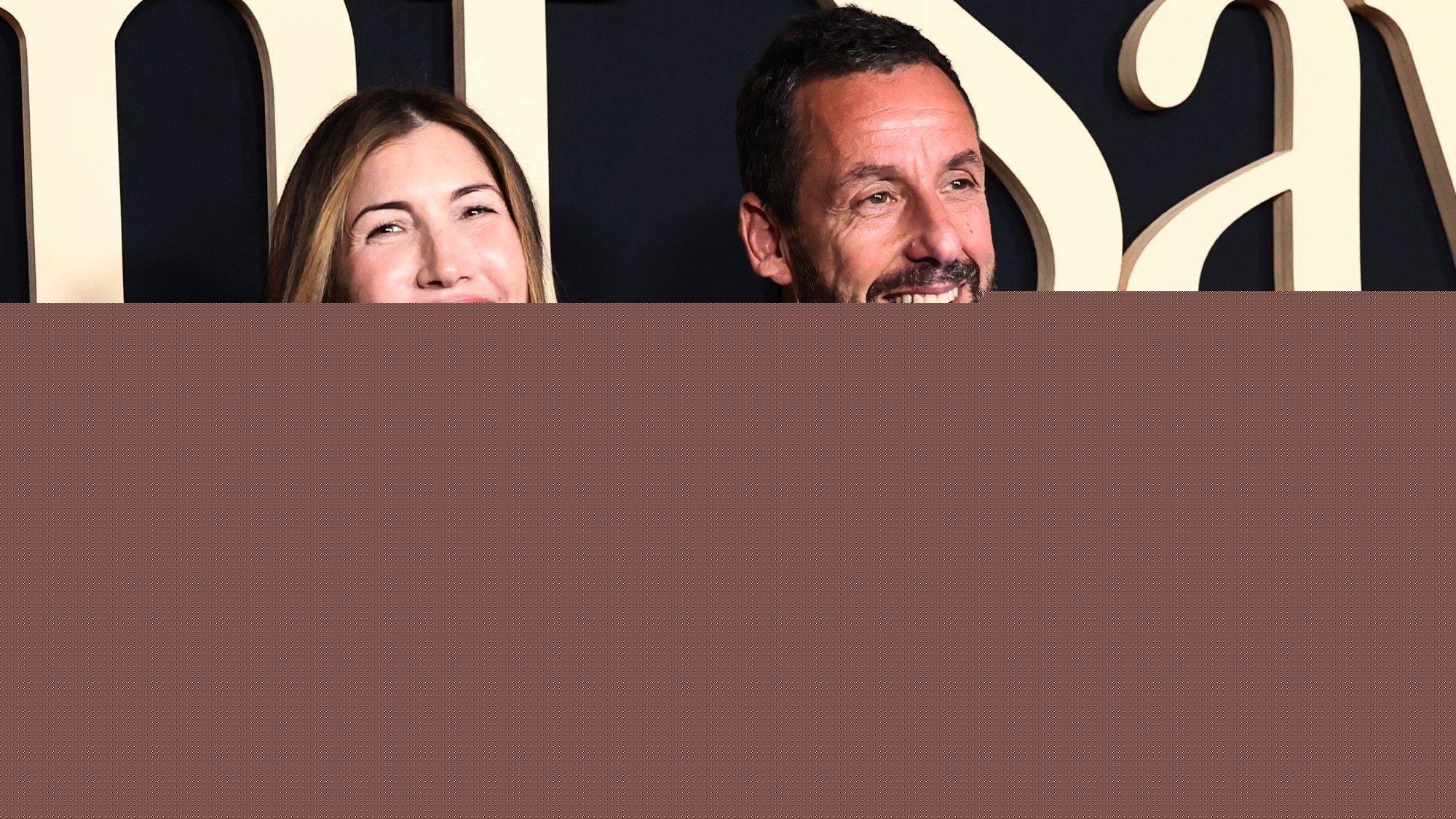 Seeing Adam Sandler’s On The Carpet In Sweats Next To His Beautifully Dressed Family Is Classic