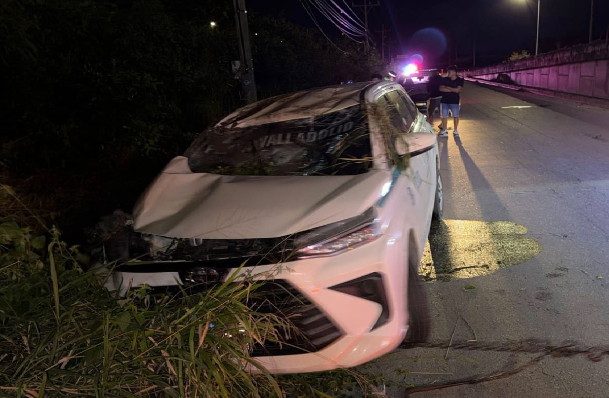 Driver taken to hospital after rolling taxi off highway overpass